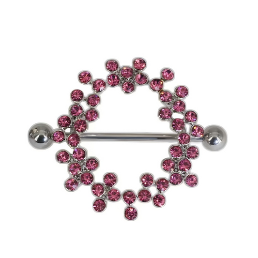 A single crystal nipple shield piercing with hot pink rhinestones in a fixed wreath design on a pure white background.