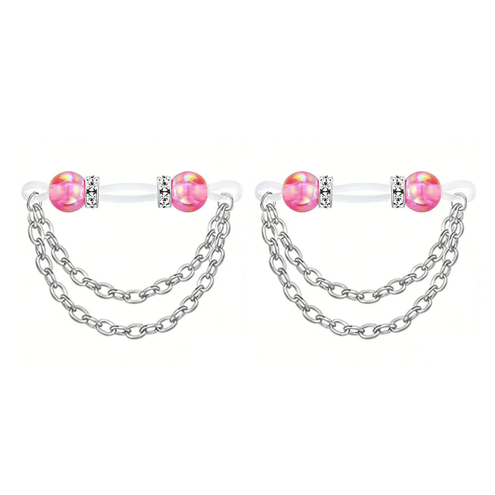 Close-up of pink shimmer pearl non-pierced nipple jewelry set for body decoration.