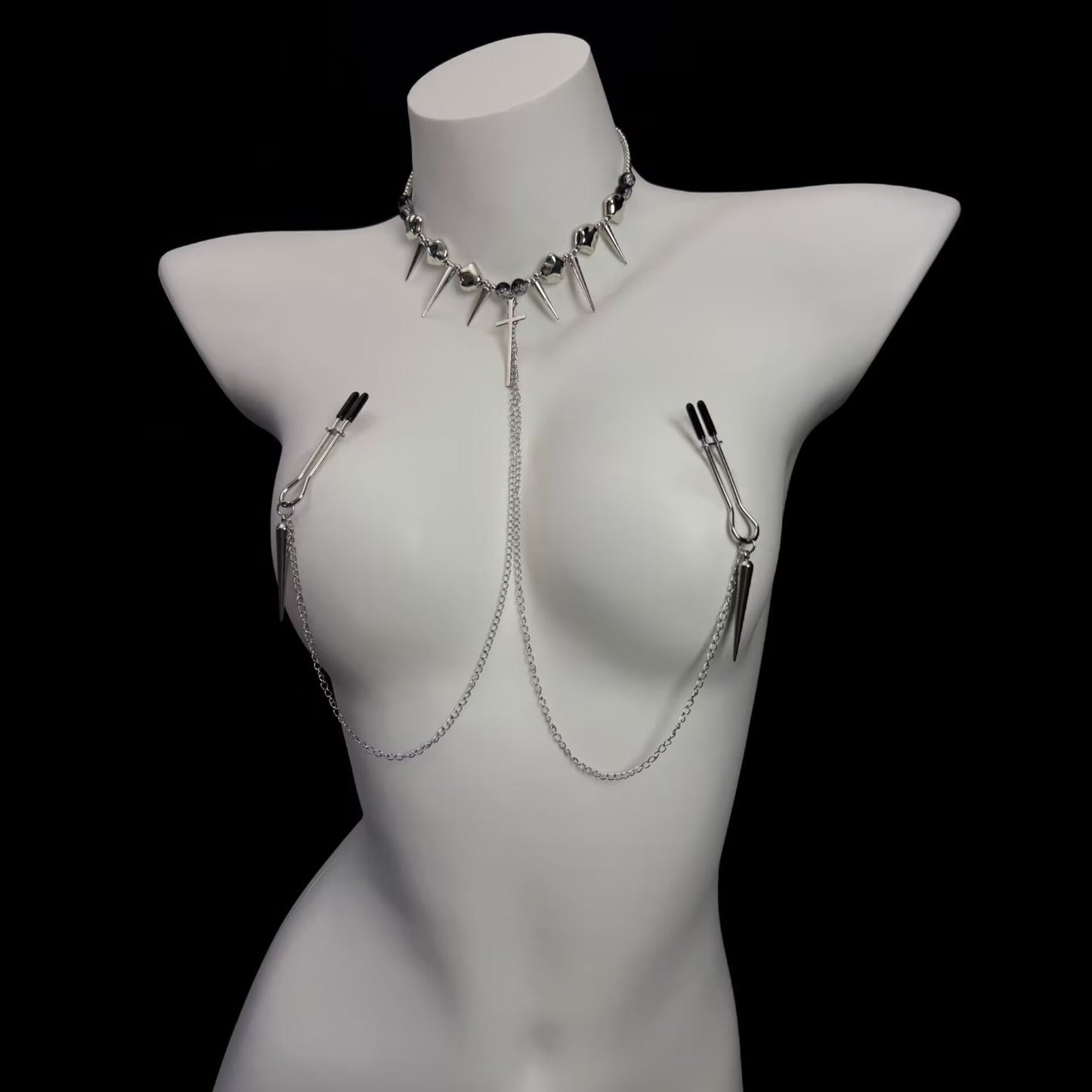 Close-up of gothic choker connected nipple chain featuring protective rubber tip metal alligator clamps.