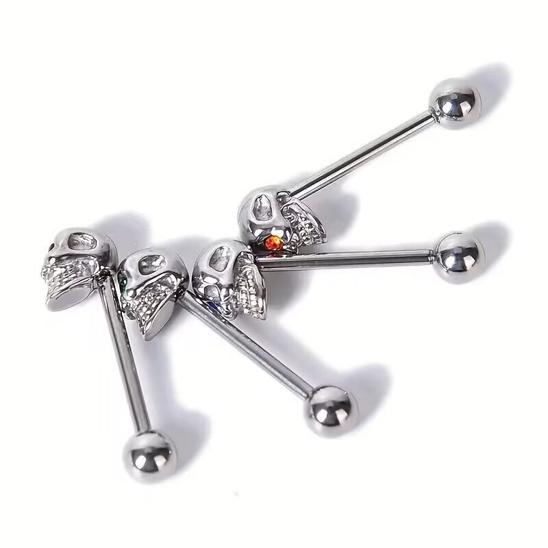 Group of punk style skull tongue bars with colorful sparkling cz gem eyes.