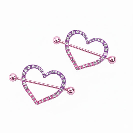 Pair of purple gradient heart-shaped nipple shields with sparkling crystal accents.