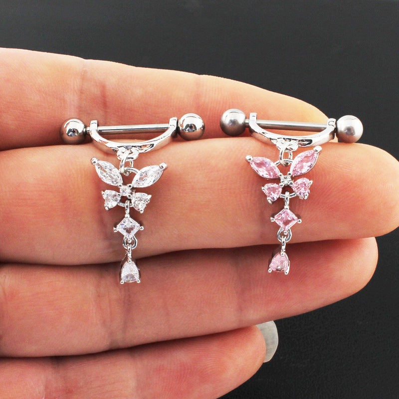 Real-life product view held in hand comparing the clear crystal and sweet pink cz butterfly dangle nipple piercing jewelry side by side.