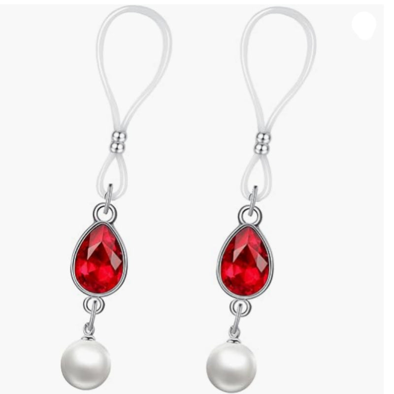 Matching pair of red faceted teardrop nipple jewelry with loop attachments, silver-tone settings and white pearl-look drops