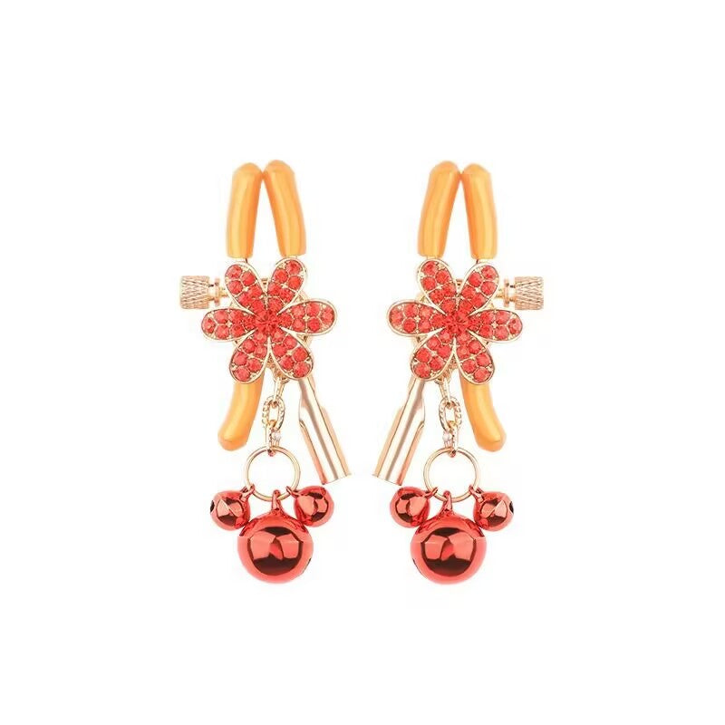 A pair of adjustable red rhinestone floral sensory clamps with bells.