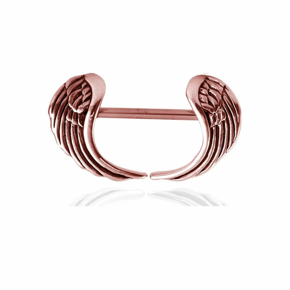 Close-up of a rose gold angel wings nipple shield barbell for body piercing aesthetic.