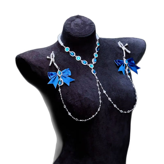 A non-piercing body chain jewelry set with royal blue bows and crystal crystals displayed on a black mannequin silhouette against a white background.