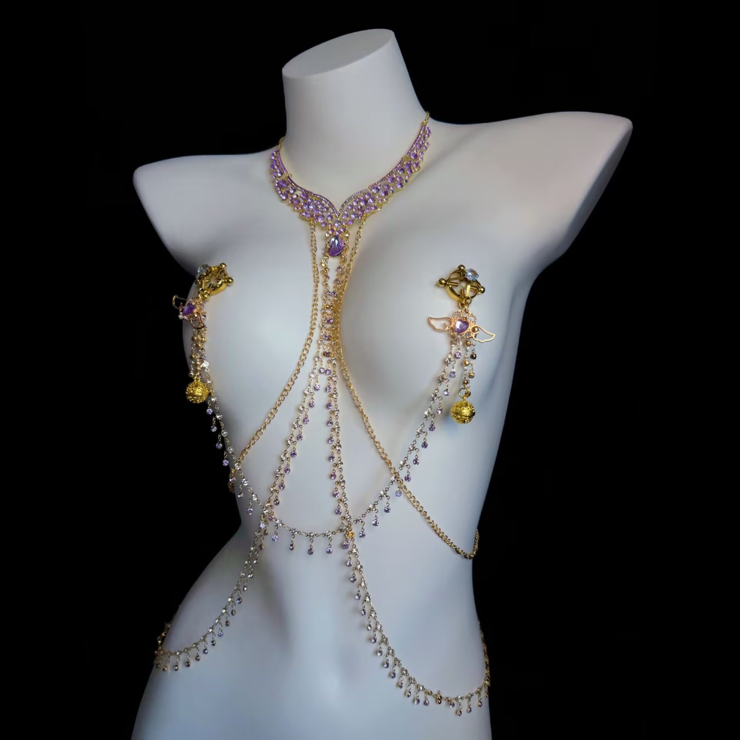 Body chain harness featuring adjustable screw-on nipple clamps with winged heart purple crystal charms.