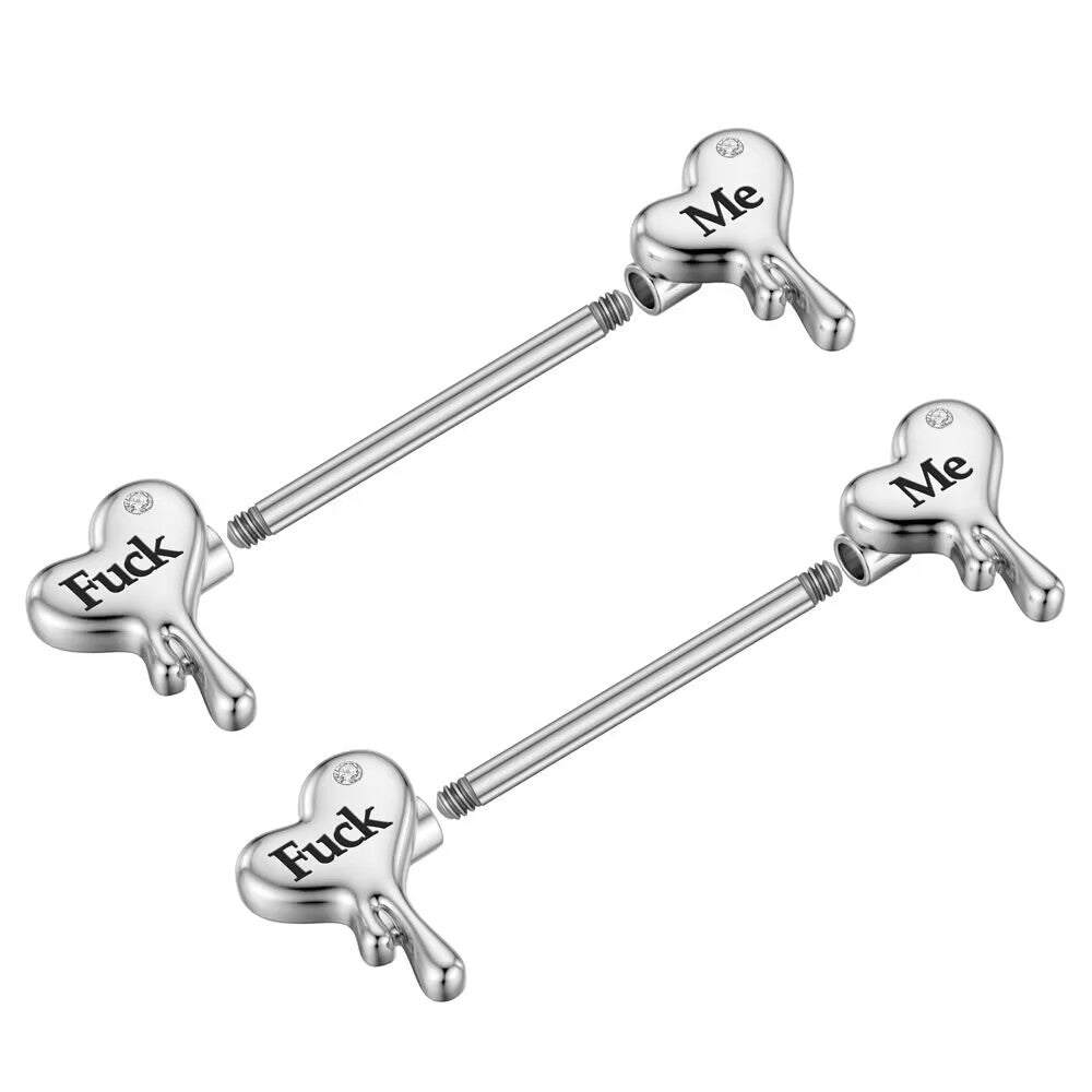 Close-up showing the screw thread mechanism and detachable heart ends of the nipple jewelry.