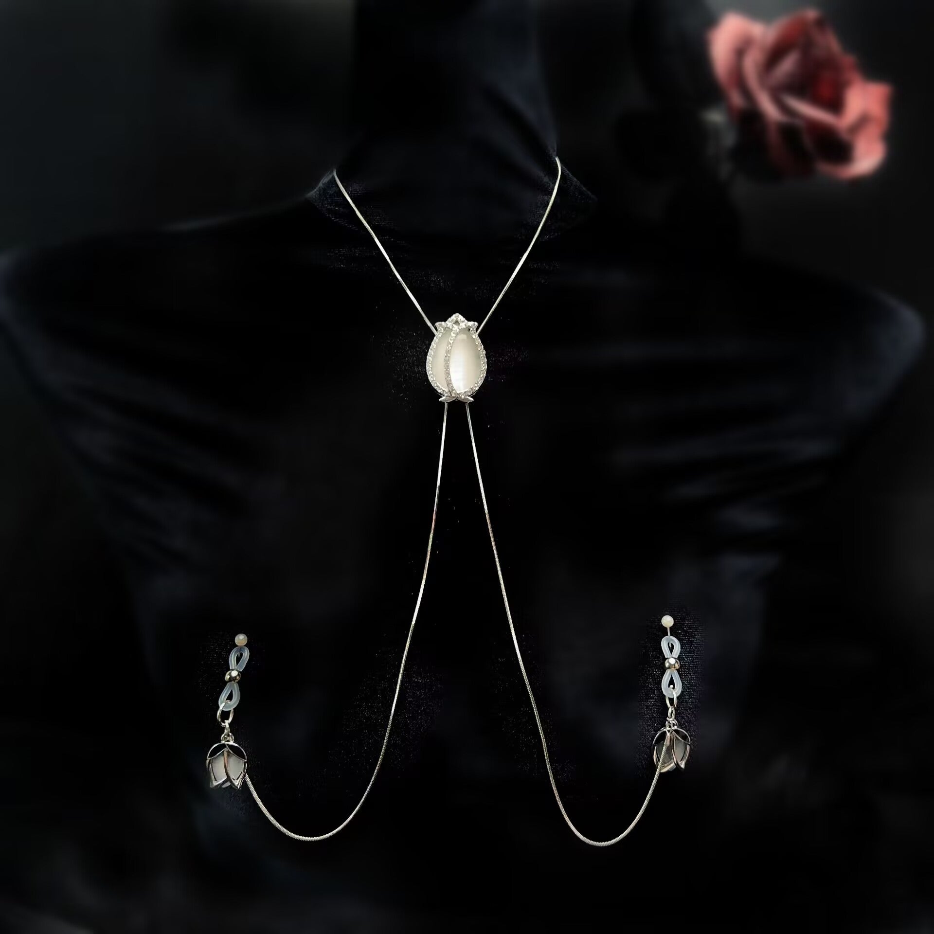 Elegant tulip body chain with adjustable nipple loops designed as a sensual accessory for women.