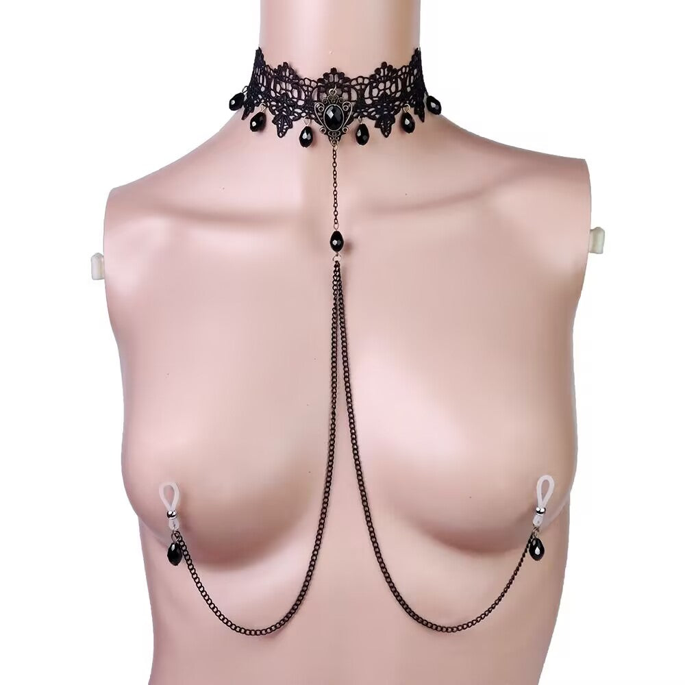 Minimalist black lace choker with a central dark gemstone and cascading metal body chains for non pierced look.