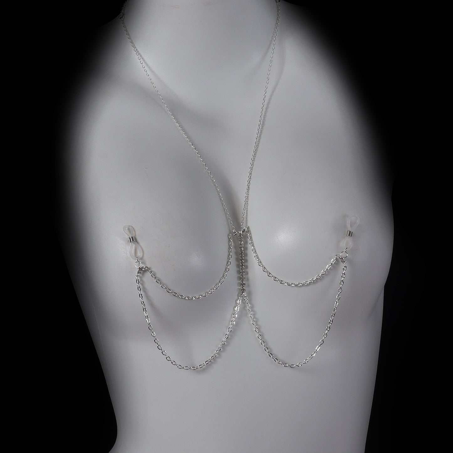 Silver-tone multilayer chest harness jewelry displayed on a white mannequin.