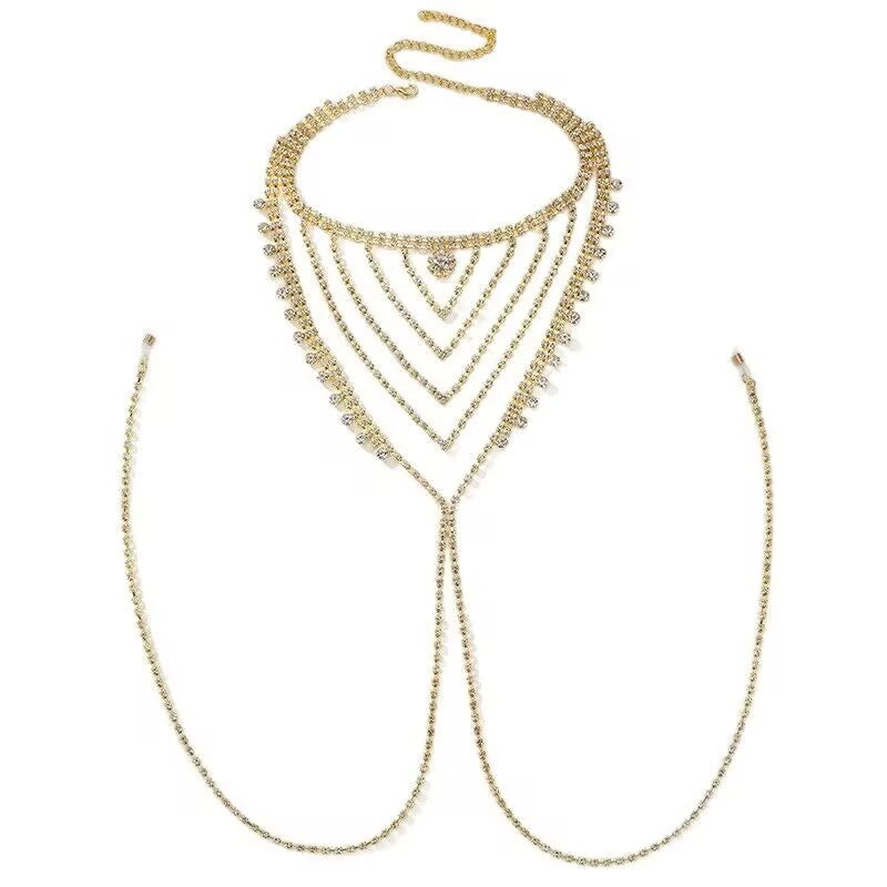 Isolated shot of a sexy sparkly gold rhinestone bikini breast jewelry harness chain on a clean white background.