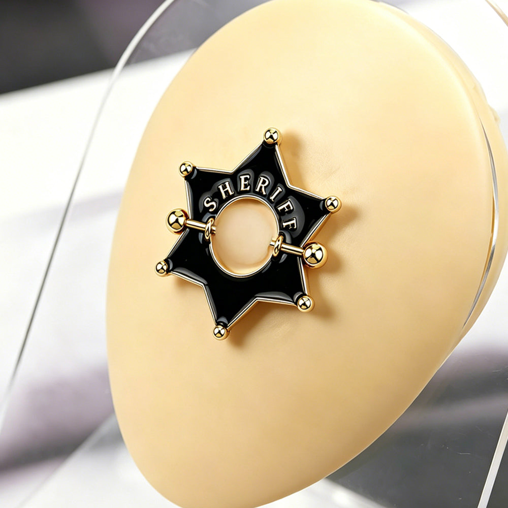 Close up view of sheriff badge nipple shield on a silicone display model
