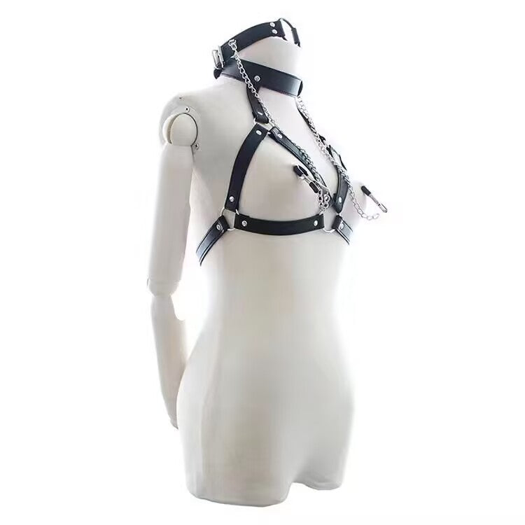 Side angle view of black leather body harness with attached O-ring choker and dangling chain nipple clamps.