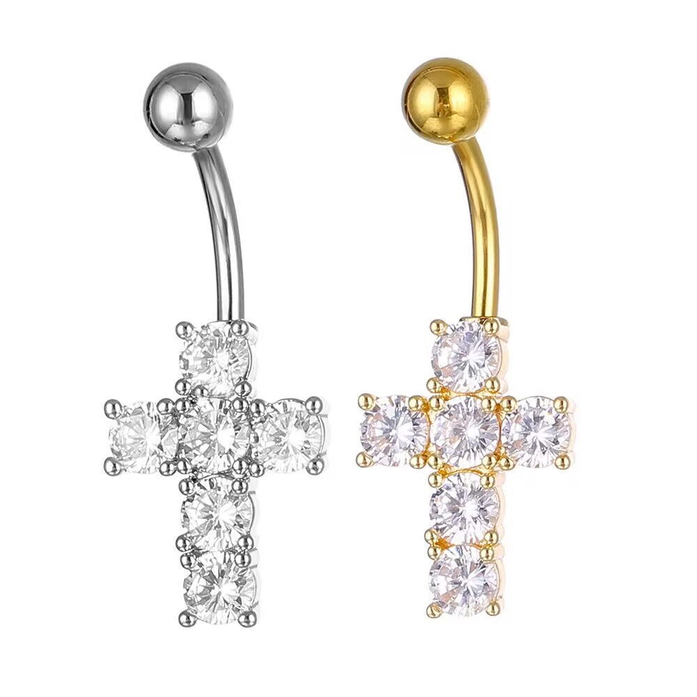 Side-by-side comparison of silver and gold cubic zirconia cross belly button rings in 14G.