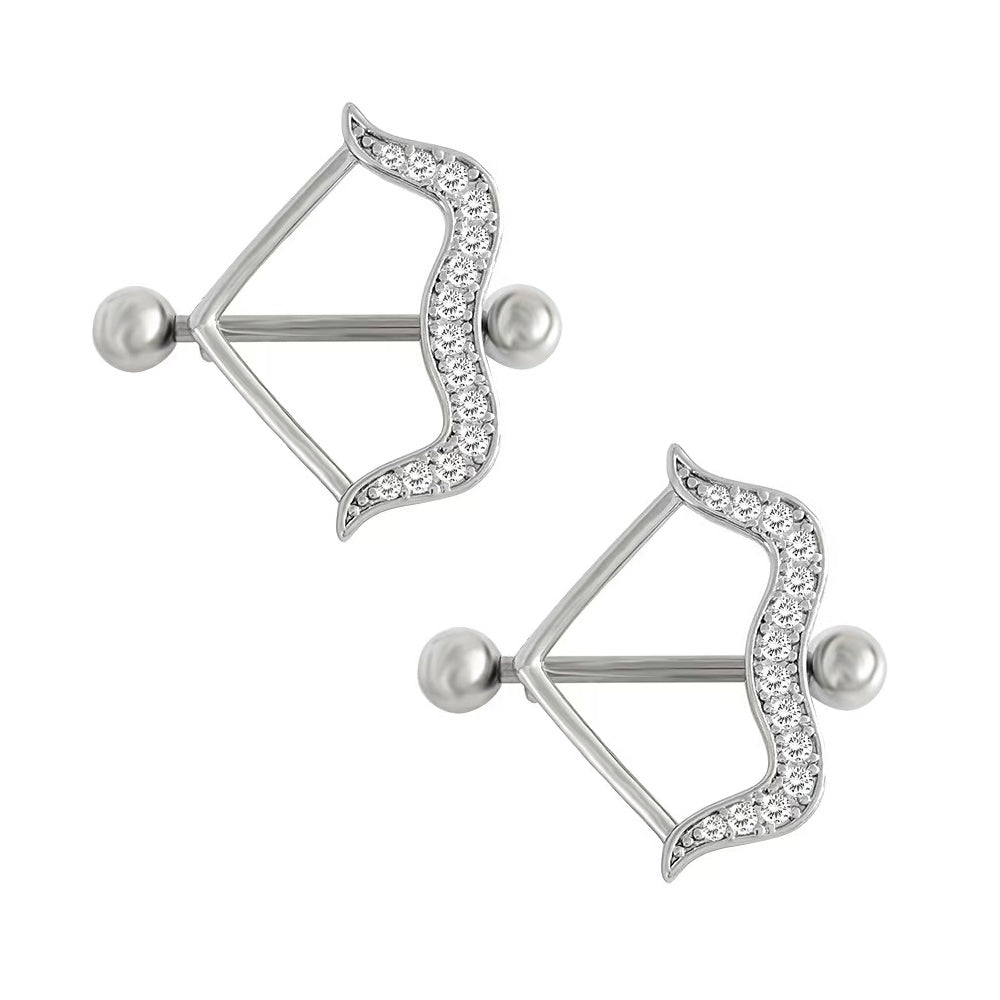 A pair of sparkling silver crystal bow nipple rings showing a stylish straight barbell design for alternative romantic body fashion.