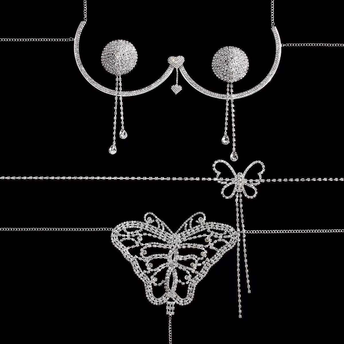 Flat lay of silver rhinestone body jewelry set including breast bracket, tassel nipple covers, and butterfly belt on black background.