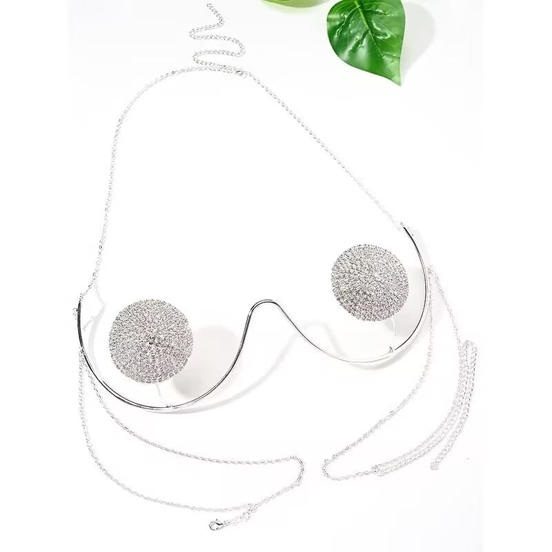 Sparkling silver crystal chest harness bra chain with fully encrusted rhinestone round plates on a white background.