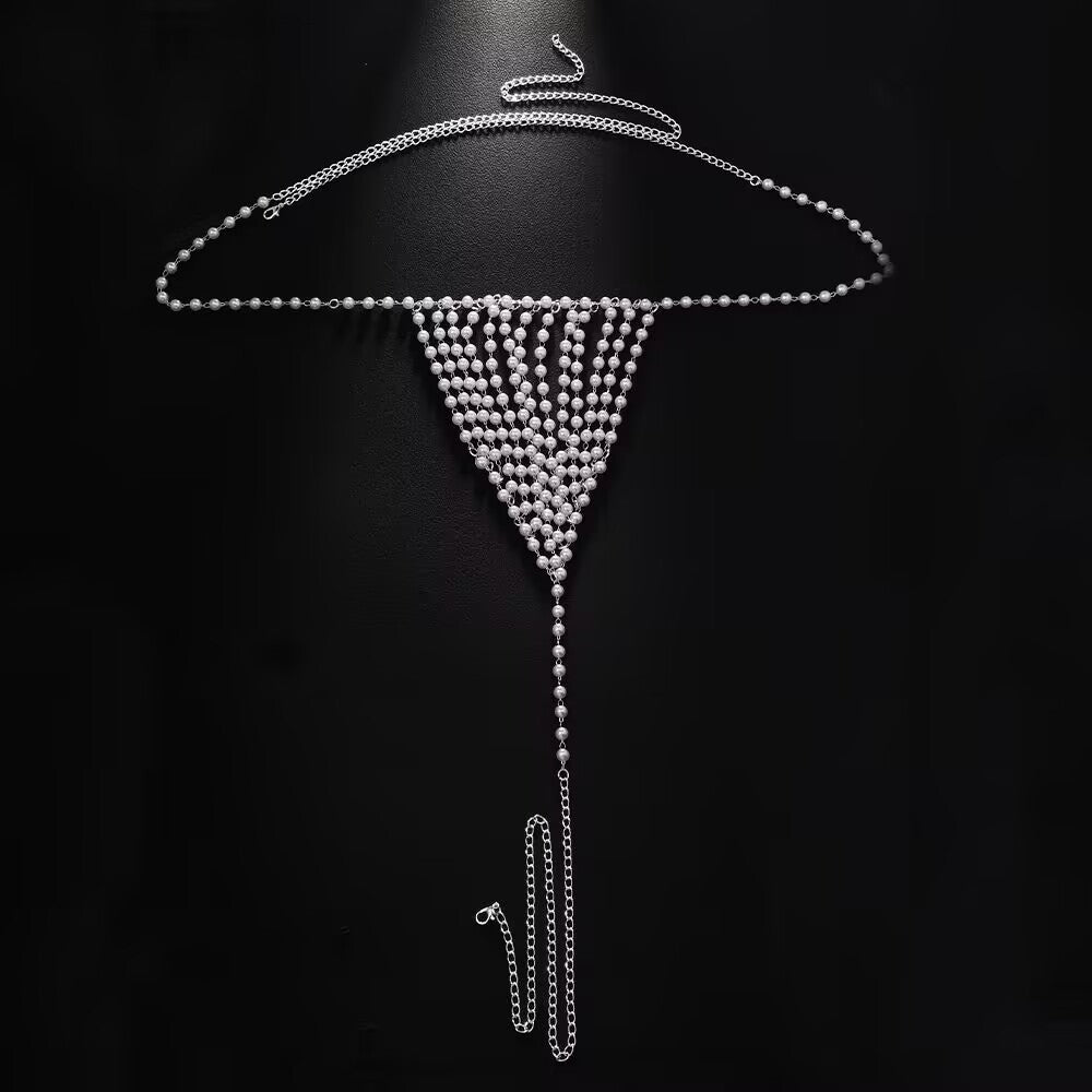 Complete view of silver pearl body harness chain thong with adjustable extender link against a dark background.