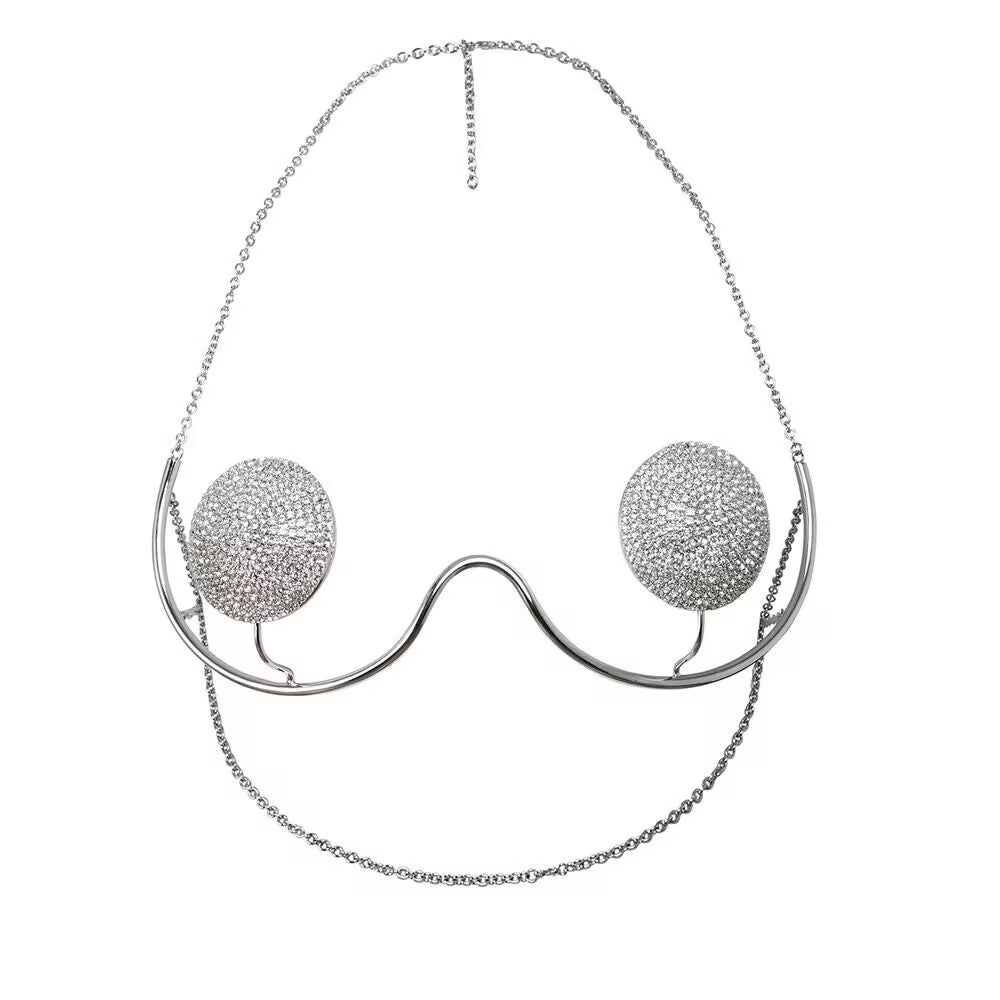 Premium silver rave body chain statement piece shaped as a cupless crystal underwire bra with adjustable back chains.