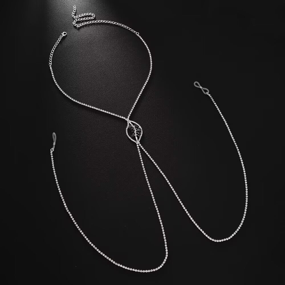 Complete silver rhinestone body harness necklace with black leaf crystal pendant displayed on a dark surface.