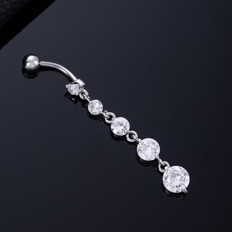 Silver dangle navel ring with graduated round brilliant cut cubic zirconia drop design.
