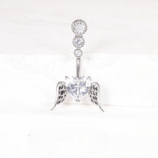 One silver-tone belly button ring with a clear cubic zirconia heart between angel wings