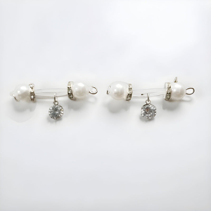 Matching pair of silver-tone non-piercing nipple jewelry with white pearl-look ends and round faceted clear charms
