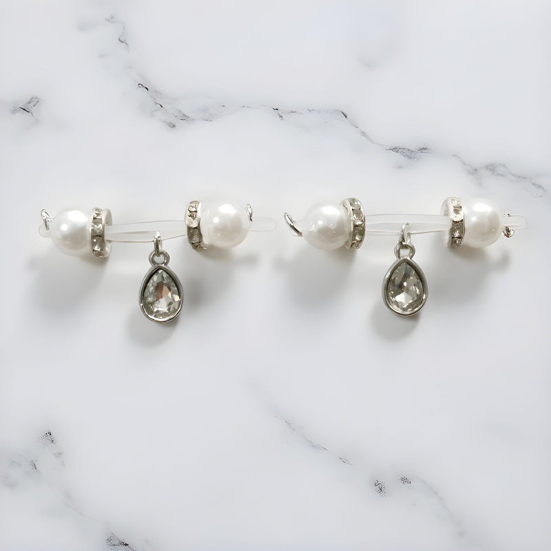Matching pair of silver-tone non-piercing nipple jewelry with white pearl-look ends and faceted teardrop charms