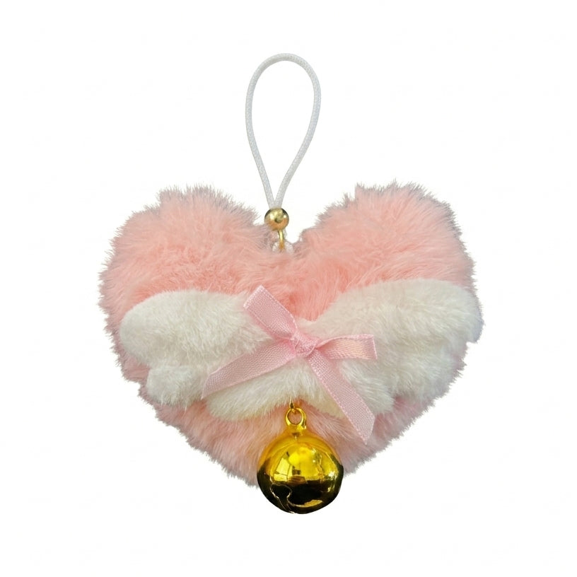 Close-up of a single pink heart-shaped nipple clamp accessory with a soft ribbon bow, fluffy white wings, and a golden bell.