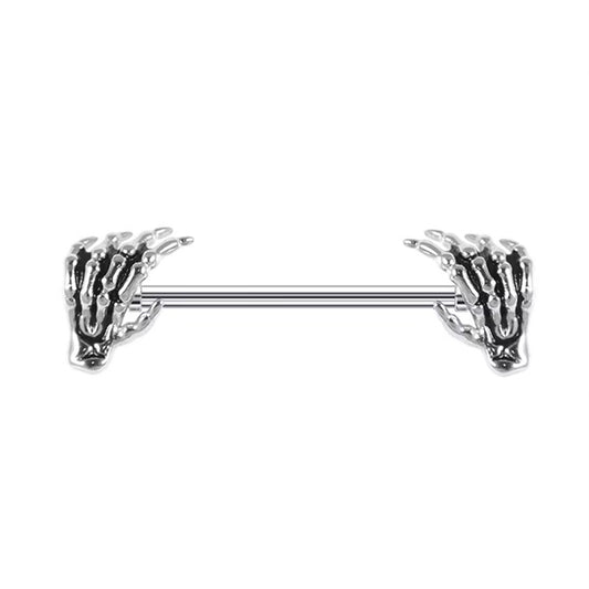 A single gothic skeleton hand nipple barbell on a pure white background.