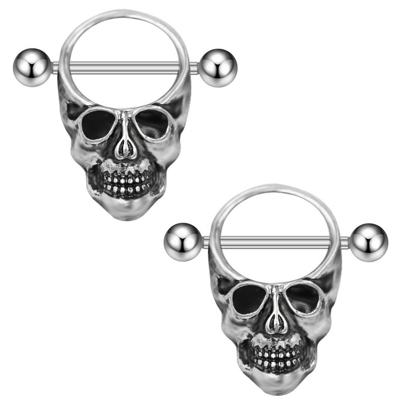 A pair of gothic human skull nipple shields with a realistic skeletal design and mirror finish