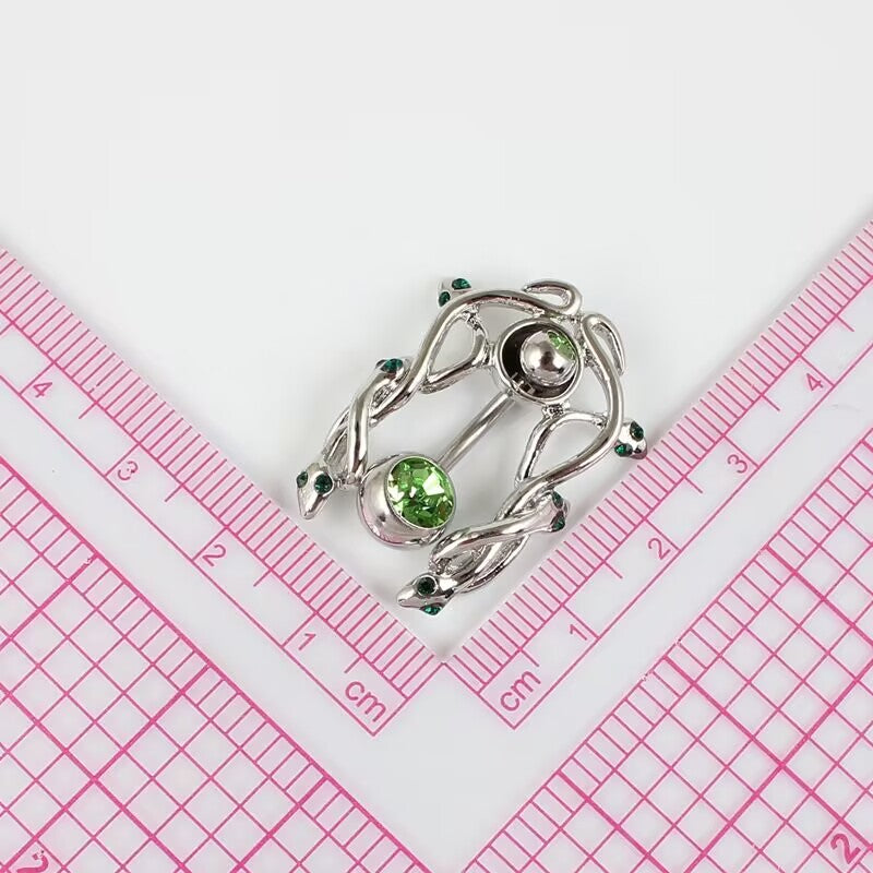 Dimension and measurement view of the snake belly ring shield next to a centimeter ruler showing product size.
