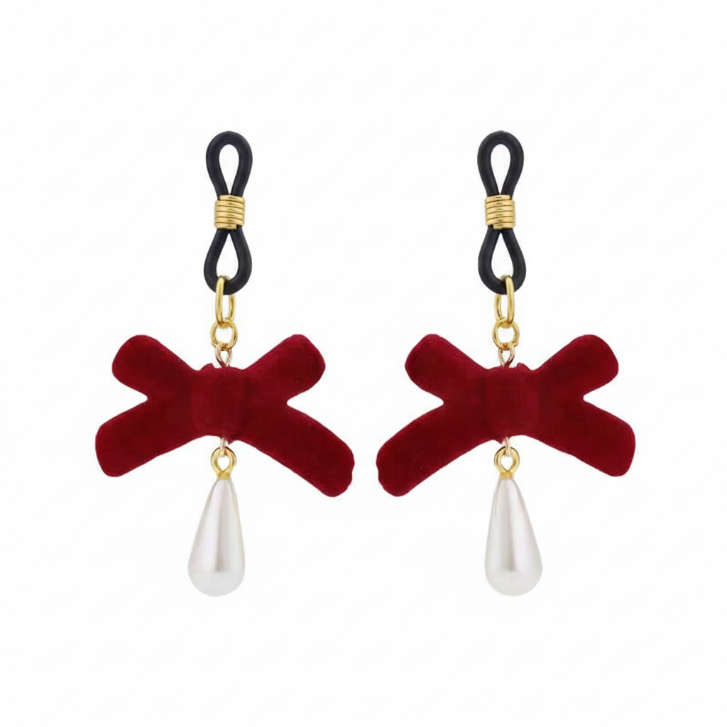 Non-piercing nipple jewelry with soft adjustable loops, red velvet bows, and a single teardrop pearl pendant.