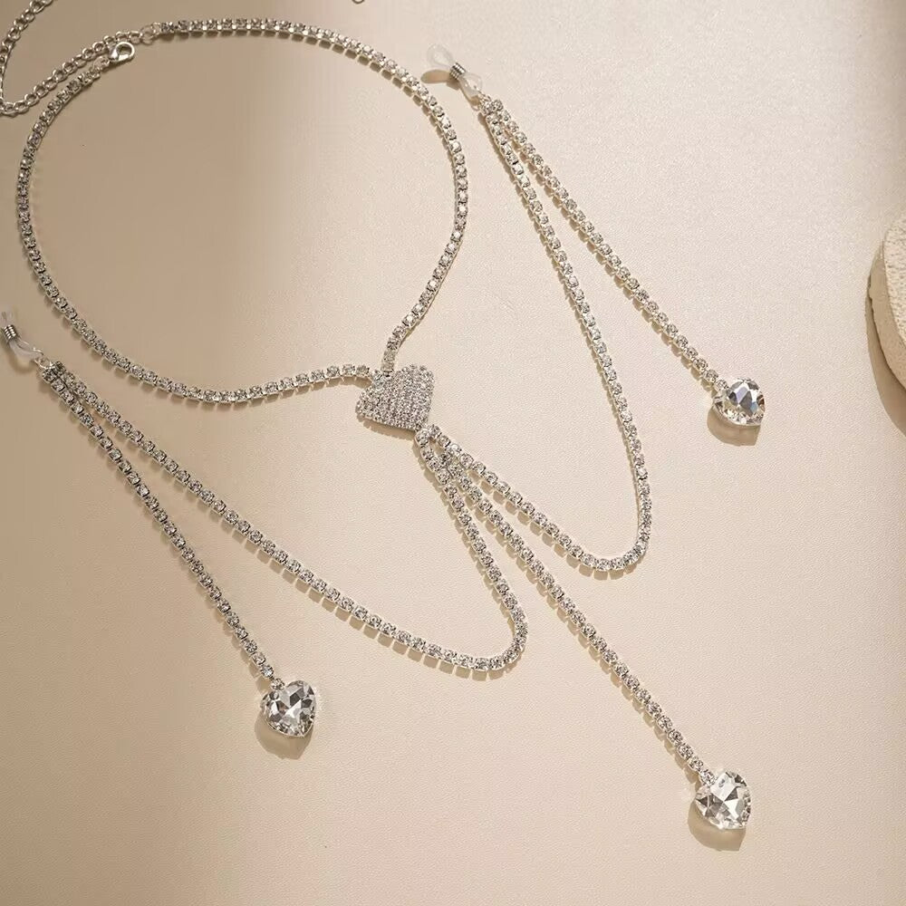 Close up detail of sparkling crystal heart dangle pendants and adjustable silicone clamp loops