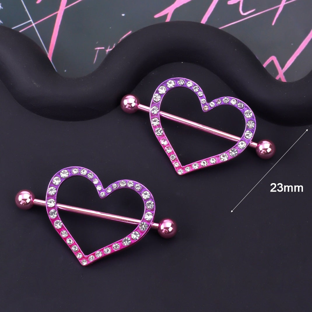 Sparkling crystal heart nipple rings in purple and pink gradient.