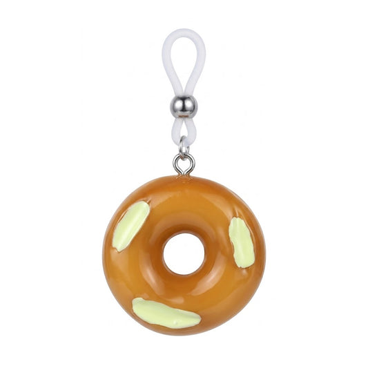 Close-up of a single brown donut non-piercing nipple ring with green frosting and adjustable silicone loop for fake body piercing.