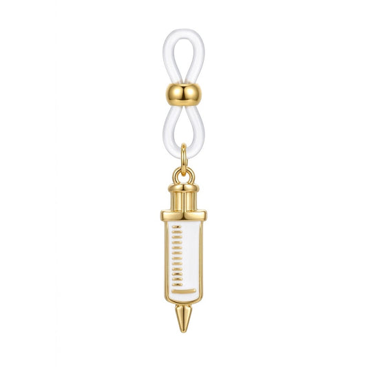 A single gold-plated syringe dangle non-pierced nipple clamp featuring a white enamel charm with measurement lines and an adjustable clear silicone loop, shot on a pure white background.