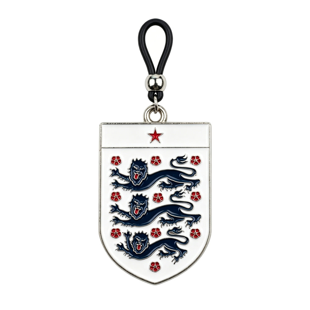A single non-piercing nipple clamp featuring a white shield emblem with three blue lions, a red star, and an adjustable black rubber loop with a silver metal slider bead.
