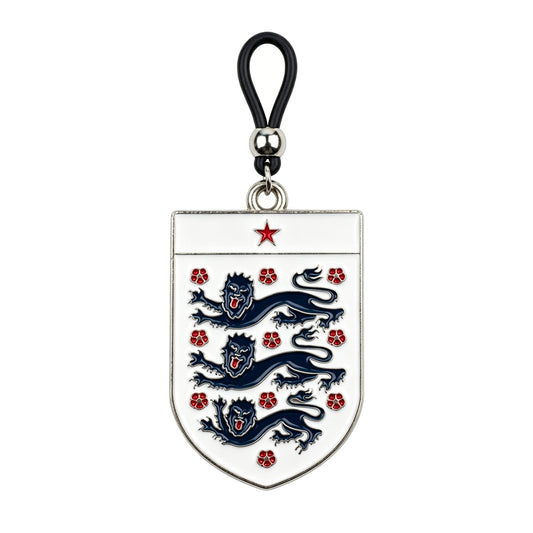 A single non-piercing nipple clamp featuring a white shield emblem with three blue lions, a red star, and an adjustable black rubber loop with a silver metal slider bead.