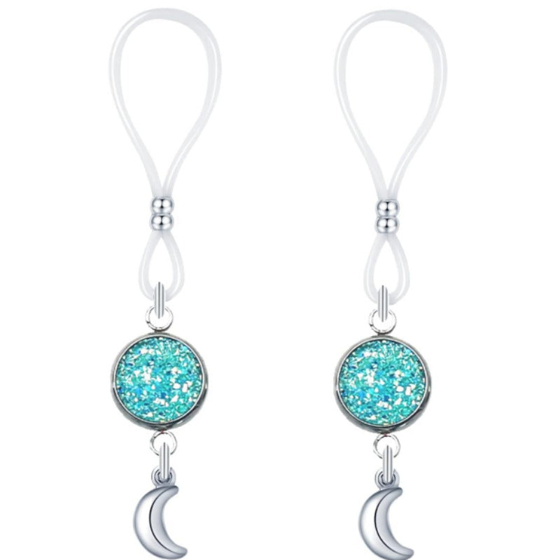 Matching pair of turquoise glitter-look round nipple jewelry with loop attachments and silver-tone crescent moon charms