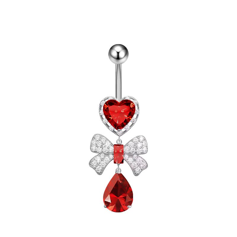 Vampire red crystal heart and shimmering bowknot teardrop dangle belly ring on a white background.