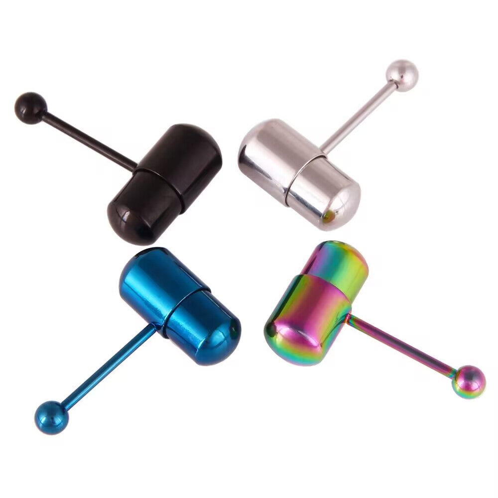 Four vibrating tongue rings featuring blue, silver, black, and rainbow pill-shaped capsule tops.
