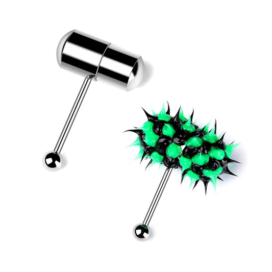 A white background comparison shot of two vibrating tongue piercing barbells. One features a sleek silver stainless steel pill-shaped capsule top, and the other features a black and lime green soft silicone spiked ball top. Both have surgical steel bars and bottom balls, shown at an angle.