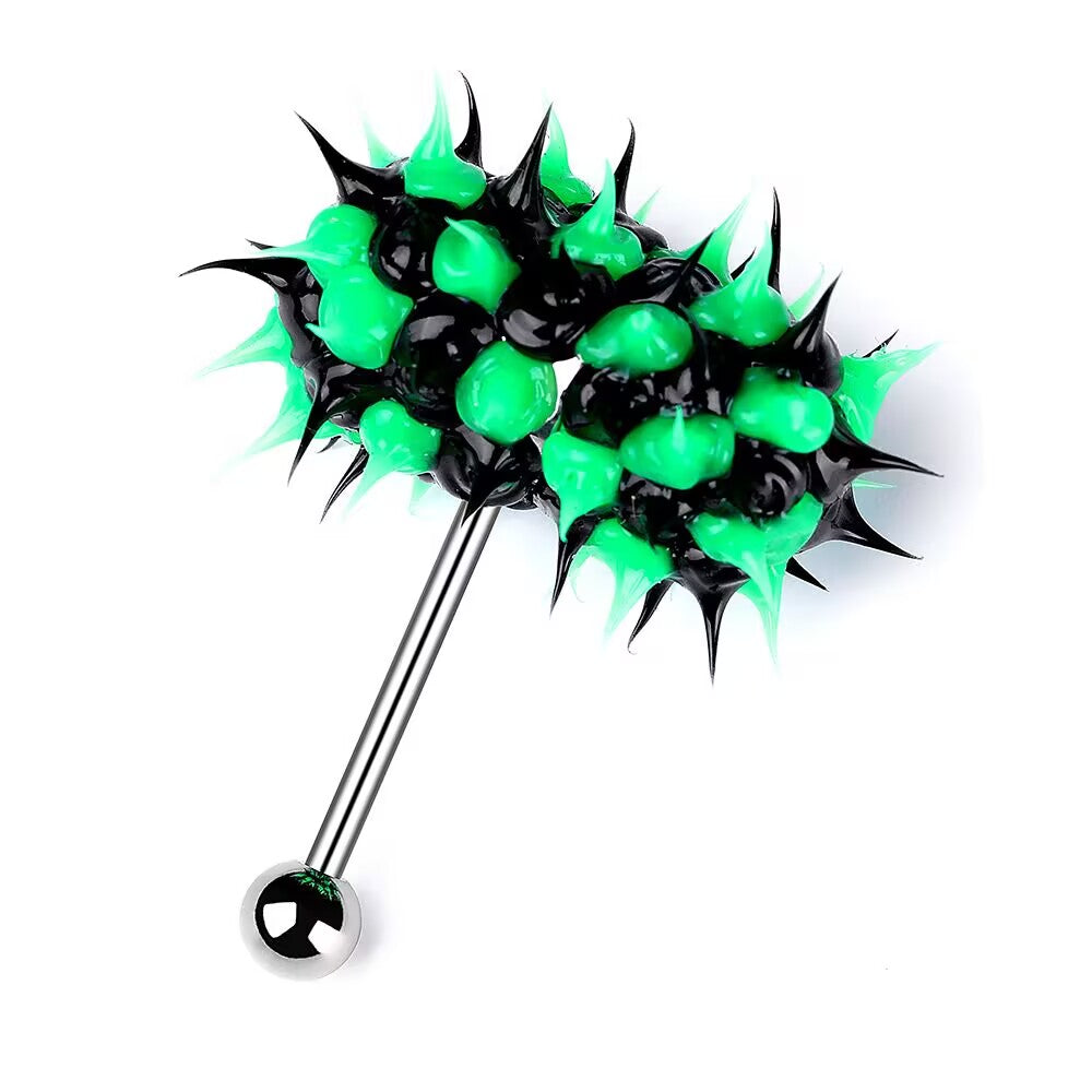 A detailed shot of a vibrating tongue piercing barbell made of surgical stainless steel with a black and lime green silicone spike design on the top. The 14G, 16mm barbell lies angled with the bottom steel ball visible against a plain white background.