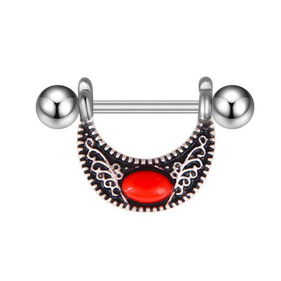 A single vintage-style nipple shield with a crescent moon design and a vibrant red stone centerpiece.