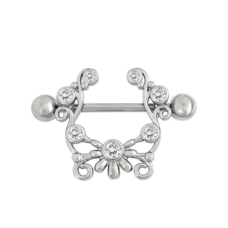 Symmetrical silver filigree nipple shield with sparkling crystal accents.