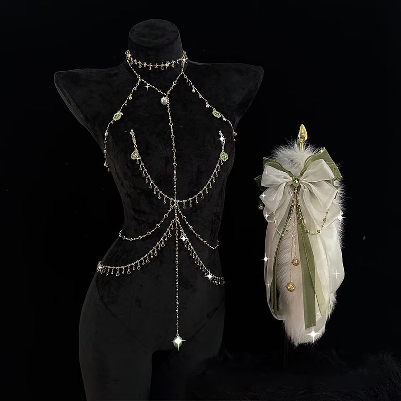 Vintage gold-tone body chain and plush tail accessory set displayed on black velvet mannequin