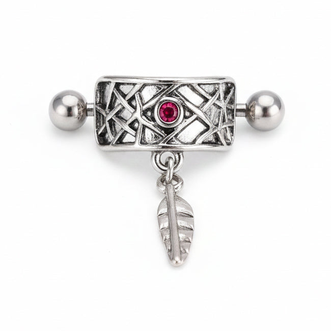 Front view of a silver vintage-style nipple shield featuring an intricate lattice pattern, a central ruby-red gemstone, and a dangling metallic leaf charm on a clean white background.