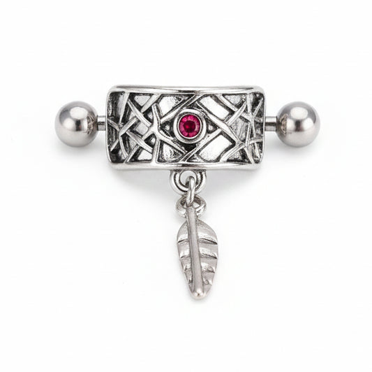 Front view of a silver vintage-style nipple shield featuring an intricate lattice pattern, a central ruby-red gemstone, and a dangling metallic leaf charm on a clean white background.